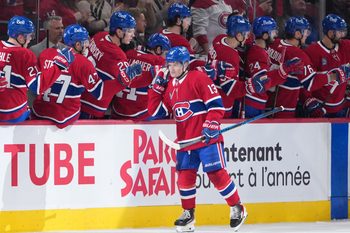 Jan 22, 2026; Montreal, Quebec, CAN; Montreal Canadiens forward Cole Caufield (13) celebrates with teammates after scoring a goal against the Buffalo Sabres during the second period at the Bell Centre. Mandatory Credit: Eric Bolte-Imagn Images