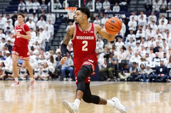Jan 22, 2026; University Park, Pennsylvania, USA; Wisconsin Badgers guard Nick Boyd (2) drives during the first half against the Penn State Nittany Lions at Rec Hall. Mandatory Credit: Matthew O'Haren-Imagn Images
