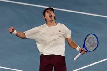 Jan 23, 2026; Melbourne, Victoria, Australia; Alex de Minaur of Australia in action against Frances Tiafoe of United States in the third round of the menís singles at the Australian Open at Rod Laver Arena in Melbourne Park. Mandatory Credit: Mike Frey-Imagn Images
