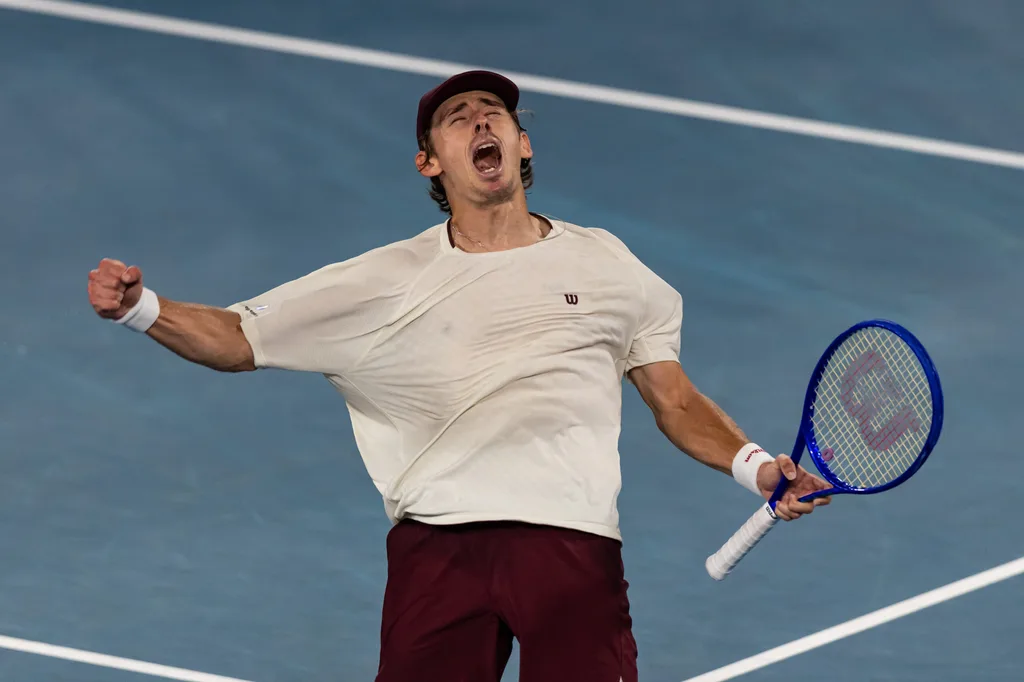 Jan 23, 2026; Melbourne, Victoria, Australia; Alex de Minaur of Australia in action against Frances Tiafoe of United States in the third round of the menís singles at the Australian Open at Rod Laver Arena in Melbourne Park. Mandatory Credit: Mike Frey-Imagn Images