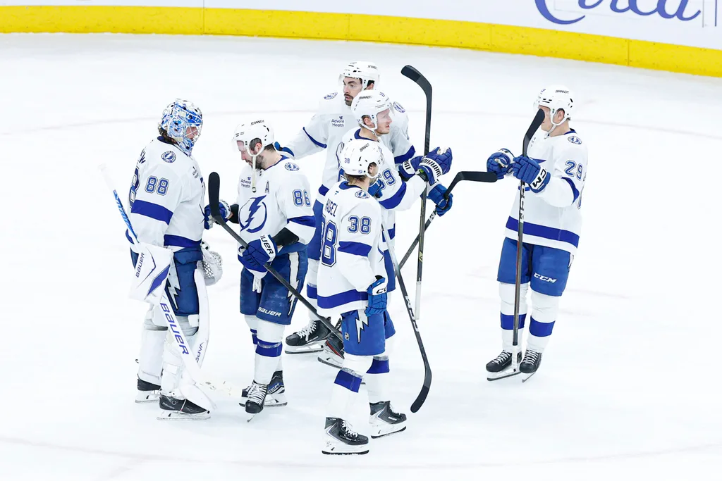 Jan 23, 2026; Chicago, Illinois, USA; Tampa Bay Lightning players celebrate after defeating the Chicago Blackhawks at United Center. Mandatory Credit: Kamil Krzaczynski-Imagn Images