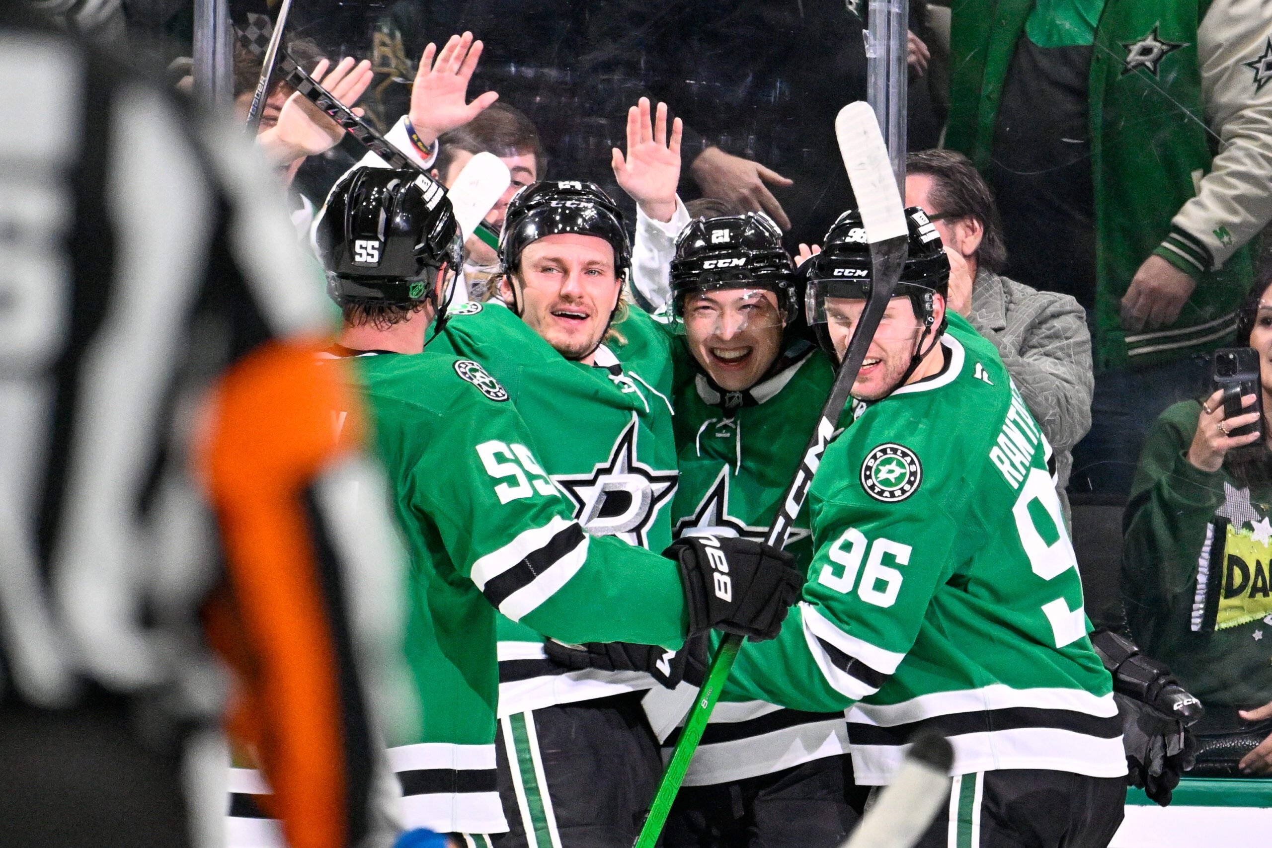 Jan 23, 2026; Dallas, Texas, USA; Dallas Stars center Roope Hintz (24) and left wing Jason Robertson (21) and right wing Mikko Rantanen (96) and defenseman Thomas Harley (55) celebrate the game winning goal scored by Robertson against the St. Louis Blues during the third period at the American Airlines Center. Mandatory Credit: Jerome Miron-Imagn Images