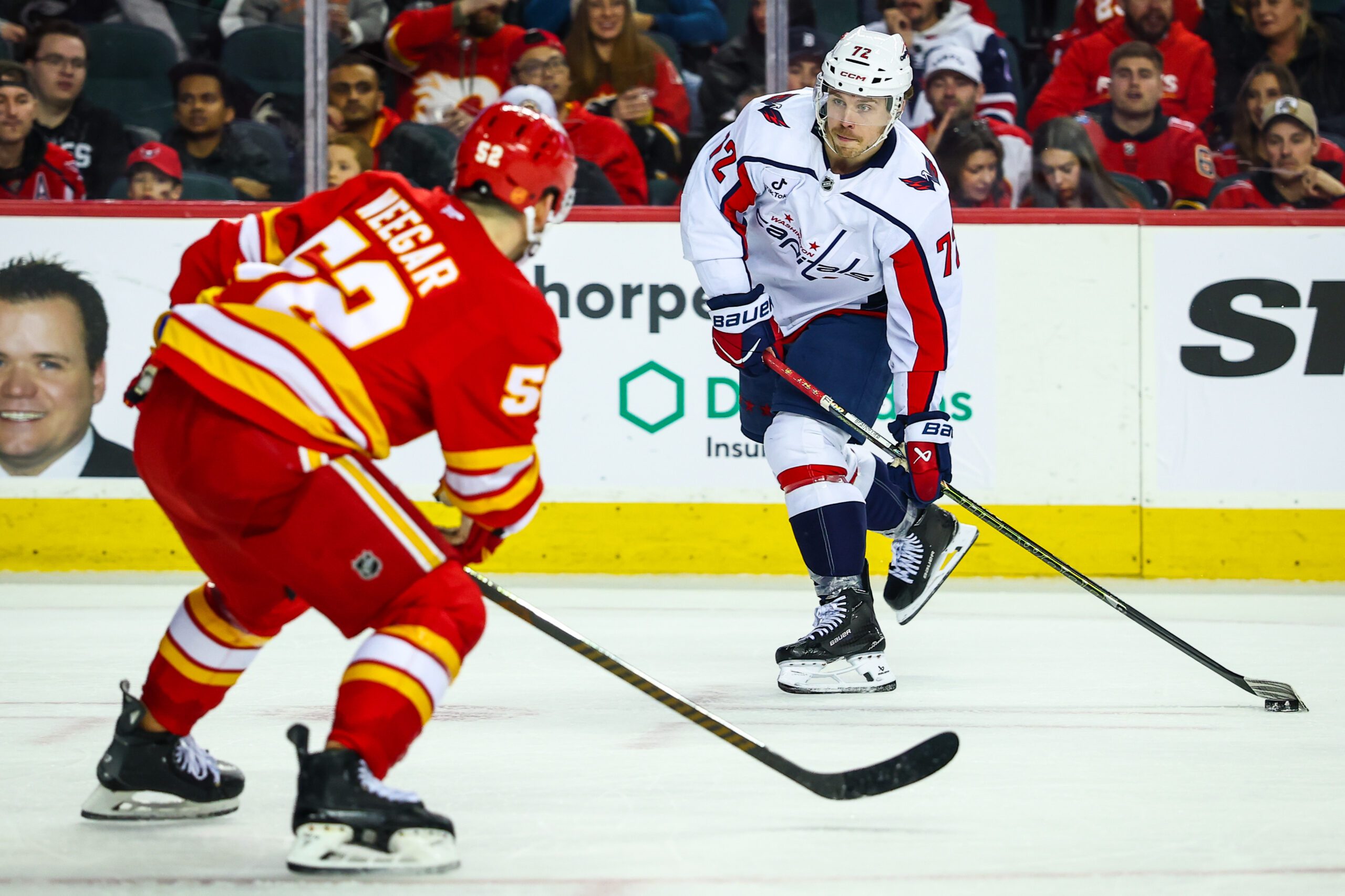Jan 23, 2026; Calgary, Alberta, CAN; Washington Capitals left wing Anthony Beauvillier (72) controls the puck against the Calgary Flames during the third period at Scotiabank Saddledome. Mandatory Credit: Sergei Belski-Imagn Images