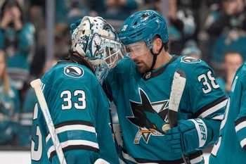 Jan 23, 2026; San Jose, California, USA;  San Jose Sharks defenseman Mario Ferraro (38) celebrates with San Jose Sharks goaltender Alex Nedeljkovic (33) after defeating the New York Rangers at SAP Center at San Jose. Mandatory Credit: Stan Szeto-Imagn Images