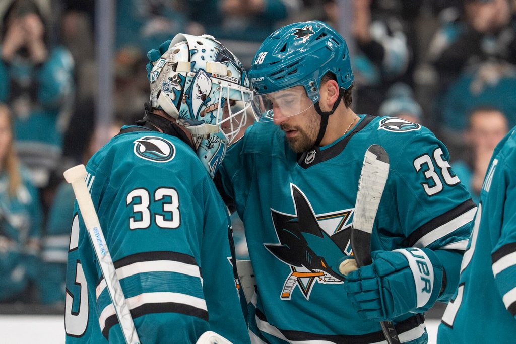 Jan 23, 2026; San Jose, California, USA; San Jose Sharks defenseman Mario Ferraro (38) celebrates with San Jose Sharks goaltender Alex Nedeljkovic (33) after defeating the New York Rangers at SAP Center at San Jose. Mandatory Credit: Stan Szeto-Imagn Images