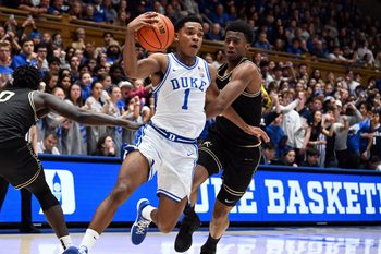 Jan 24, 2026; Durham, North Carolina, USA; Duke Blue Devils guard Caleb Foster (1) drives to the basket as Wake Forest Demon Deacons guard Myles Colvin (6) defends during the second half at Cameron Indoor Stadium. Mandatory Credit: Rob Kinnan-Imagn Images