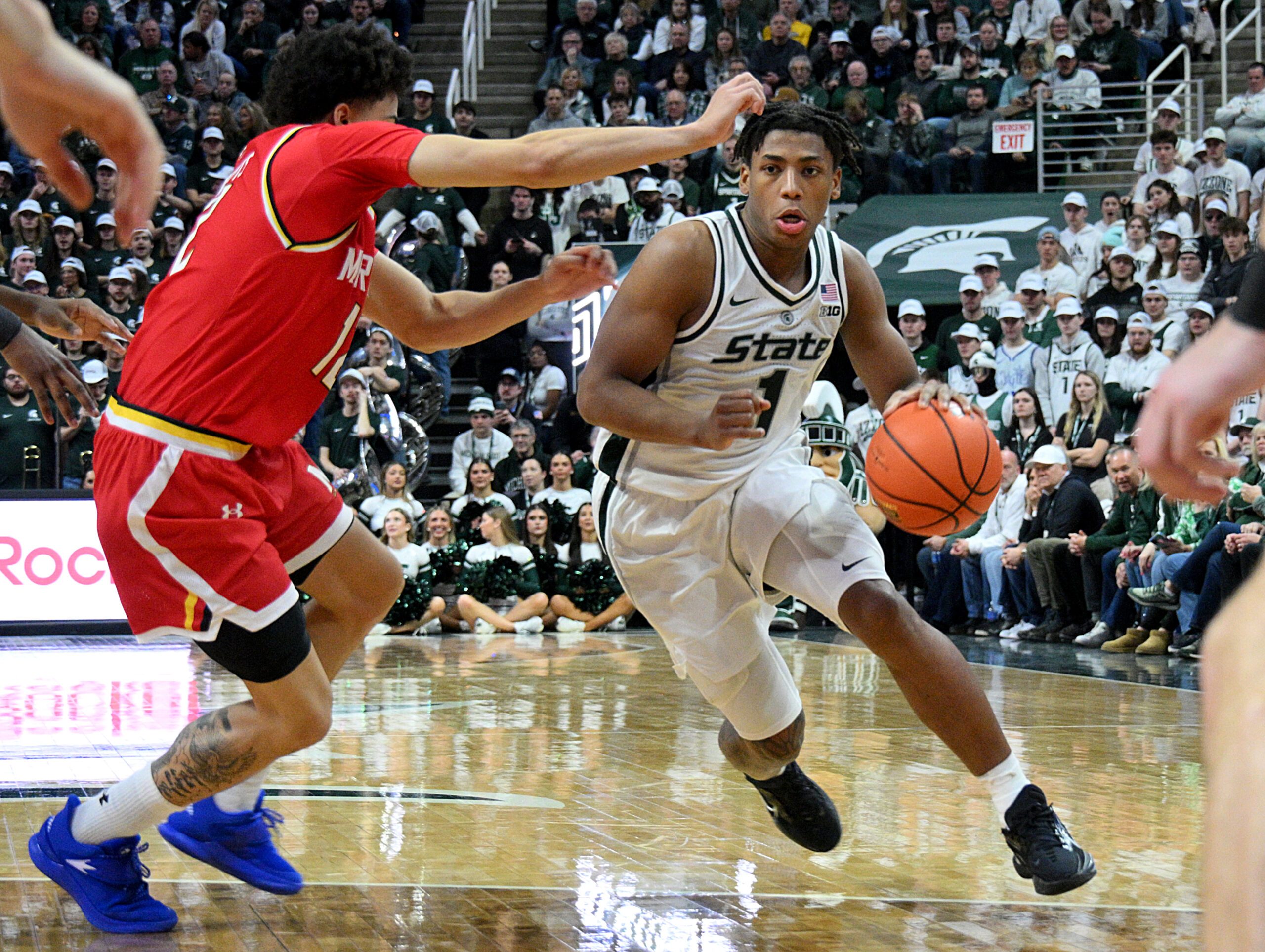 Jan 24, 2026; East Lansing, Michigan, USA;  Michigan State Spartans guard Jeremy Fears Jr. (1) drives past Maryland Terrapins guard Isaiah Watts (12) during the second half at Jack Breslin Student Events Center. Mandatory Credit: Dale Young-Imagn Images