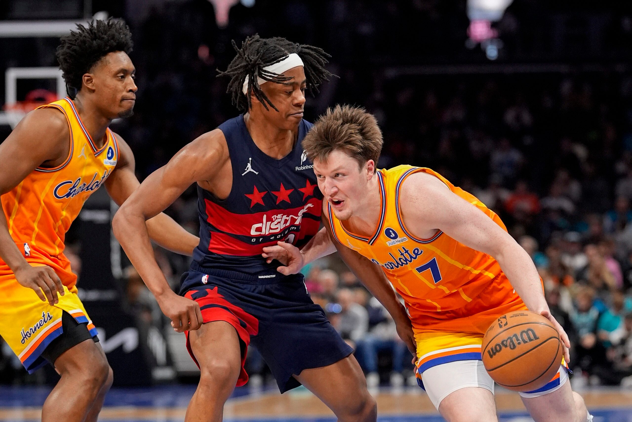Jan 24, 2026; Charlotte, North Carolina, USA; Charlotte Hornets guard/forward Kon Knueppel (7) drives to the basket against Washington Wizards guard Tre Johnson (12) during the second half at the Spectrum Center. Mandatory Credit: Jim Dedmon-Imagn Images
