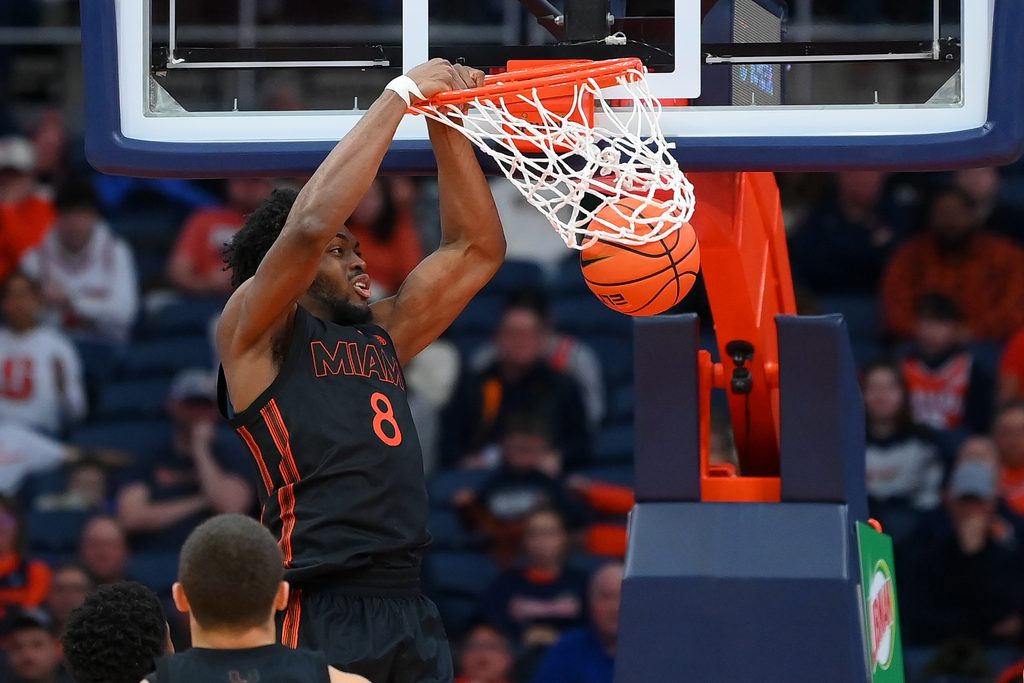 Jan 24, 2026; Syracuse, New York, USA; Miami Hurricanes center Ernest Udeh Jr. (8) dunks during the second half against the Syracuse Orange at the JMA Wireless Dome. Mandatory Credit: Rich Barnes-Imagn Images