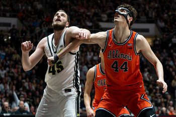 Jan 24, 2026; West Lafayette, Indiana, USA; Illinois Fighting Illini center Zvonimir Ivisic (44) pulls down the jersey of Purdue Boilermakers center Oscar Cluff (45) during the second half at Mackey Arena. Mandatory Credit: Jacob Musselman-Imagn Images