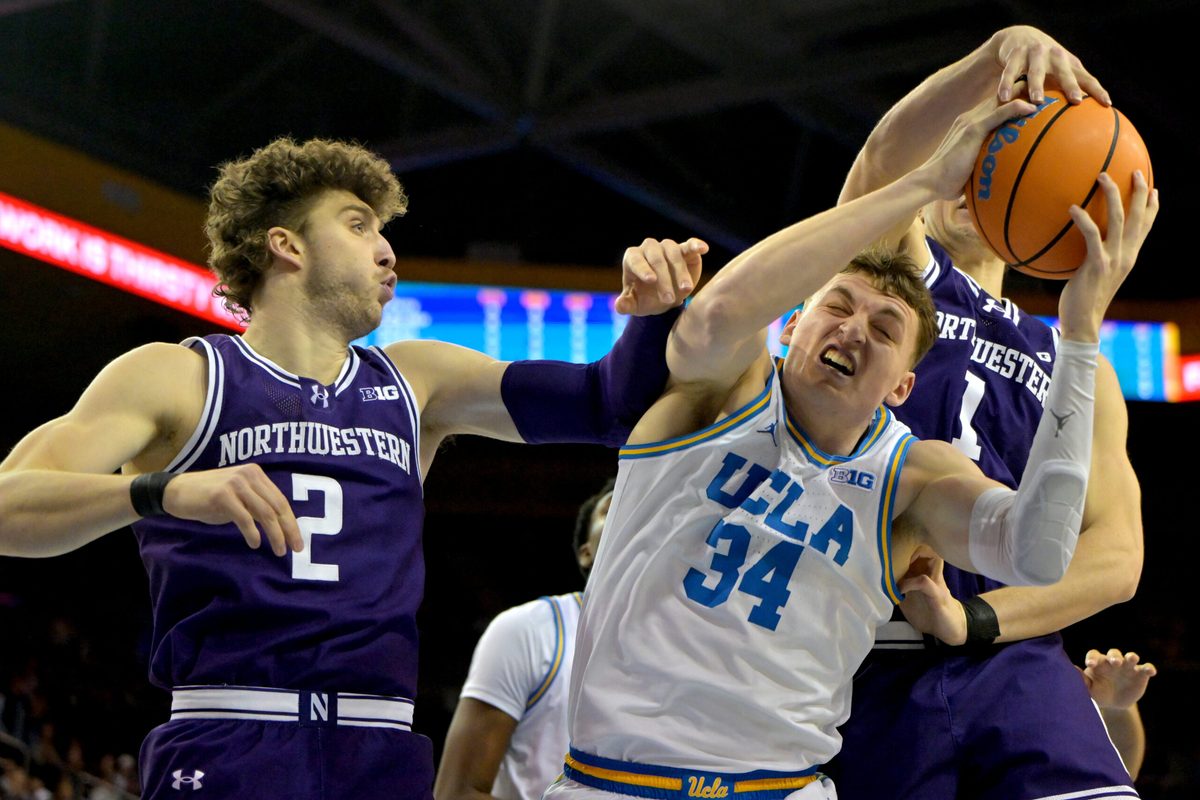 Jan 24, 2026; Los Angeles, California, USA;  Northwestern Wildcats forward Nick Martinelli (2) and forward Tyler Kropp (1) defend UCLA Bruins forward Tyler Bilodeau (34) in the first half at Pauley Pavilion presented by Wescom Financial. Mandatory Credit: Jayne Kamin-Oncea-Imagn Images