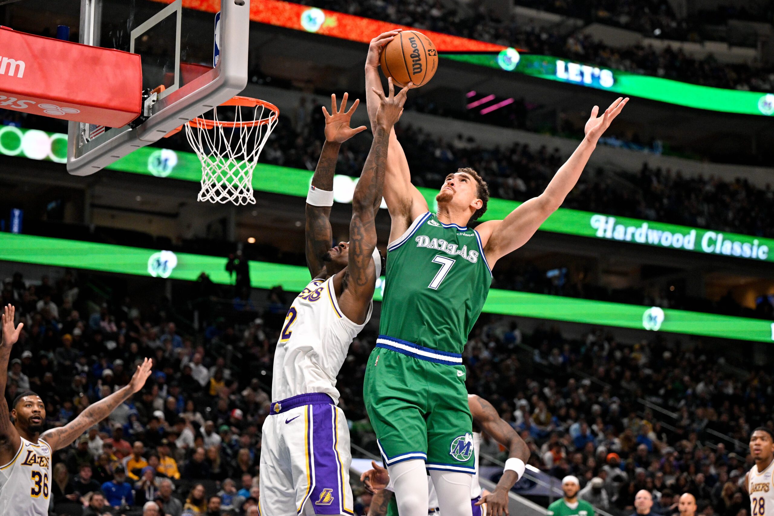 Jan 24, 2026; Dallas, Texas, USA; Los Angeles Lakers forward Jarred Vanderbilt (2) and Dallas Mavericks forward Dwight Powell (7) battle for the rebound during the second quarter at the American Airlines Center. Mandatory Credit: Jerome Miron-Imagn Images