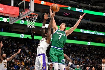 Jan 24, 2026; Dallas, Texas, USA; Los Angeles Lakers forward Jarred Vanderbilt (2) and Dallas Mavericks forward Dwight Powell (7) battle for the rebound during the second quarter at the American Airlines Center. Mandatory Credit: Jerome Miron-Imagn Images