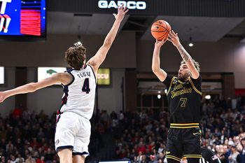 Jan 24, 2026; Spokane, Washington, USA; San Francisco Dons guard Vukasin Masic (7) shoots the ball against Gonzaga Bulldogs guard Davis Fogle (4) in the second half at McCarthey Athletic Center. Gonzaga Bulldogs won 68-66. Mandatory Credit: James Snook-Imagn Images