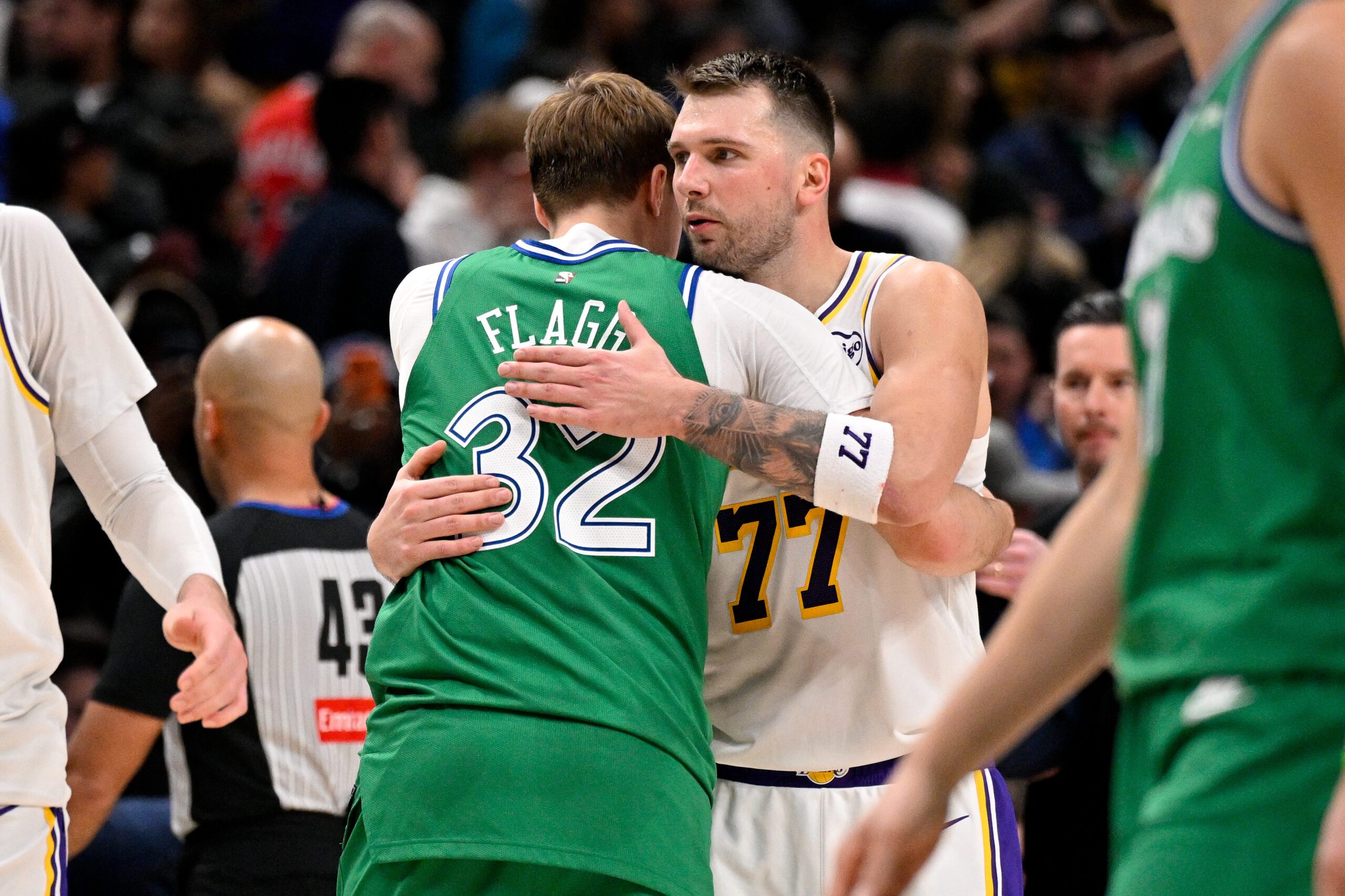 Jan 24, 2026; Dallas, Texas, USA; Dallas Mavericks forward Cooper Flagg (32) hugs Los Angeles Lakers guard Luka Doncic (77) after the game at the American Airlines Center. Mandatory Credit: Jerome Miron-Imagn Images