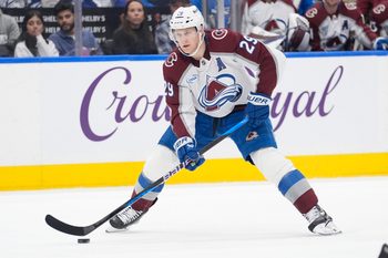 Jan 25, 2026; Toronto, Ontario, CAN; Colorado Avalanche forward Nathan MacKinnon (29) carries the puck against the Toronto Maple Leafs during the second period at Scotiabank Arena. Mandatory Credit: John E. Sokolowski-Imagn Images