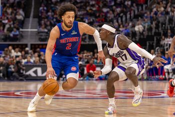 Jan 25, 2026; Detroit, Michigan, USA; Sacramento Kings guard Dennis Schroder (17) defends against Detroit Pistons guard Cade Cunningham (2) during the during the second half at Little Caesars Arena. Mandatory Credit: David Reginek-Imagn Images