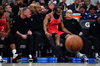 Jan 25, 2026; Inglewood, California, USA; Los Angeles Clippers guard James Harden (1) lands on the bench next to assistant coaches Brian Shaw and Jeff Van Gundy after scoring a three point basket against the Brooklyn Nets during the first half at Intuit Dome. Mandatory Credit: Gary A. Vasquez-Imagn Images