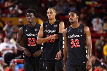 Jan 24, 2026; Tempe, Arizona, USA; Cincinnati Bearcats center Moustapha Thiam (52), forward Baba Miller (18) and guard Jalen Celestine (32) against the Arizona State Sun Devils at Desert Financial Arena. Mandatory Credit: Mark J. Rebilas-Imagn Images