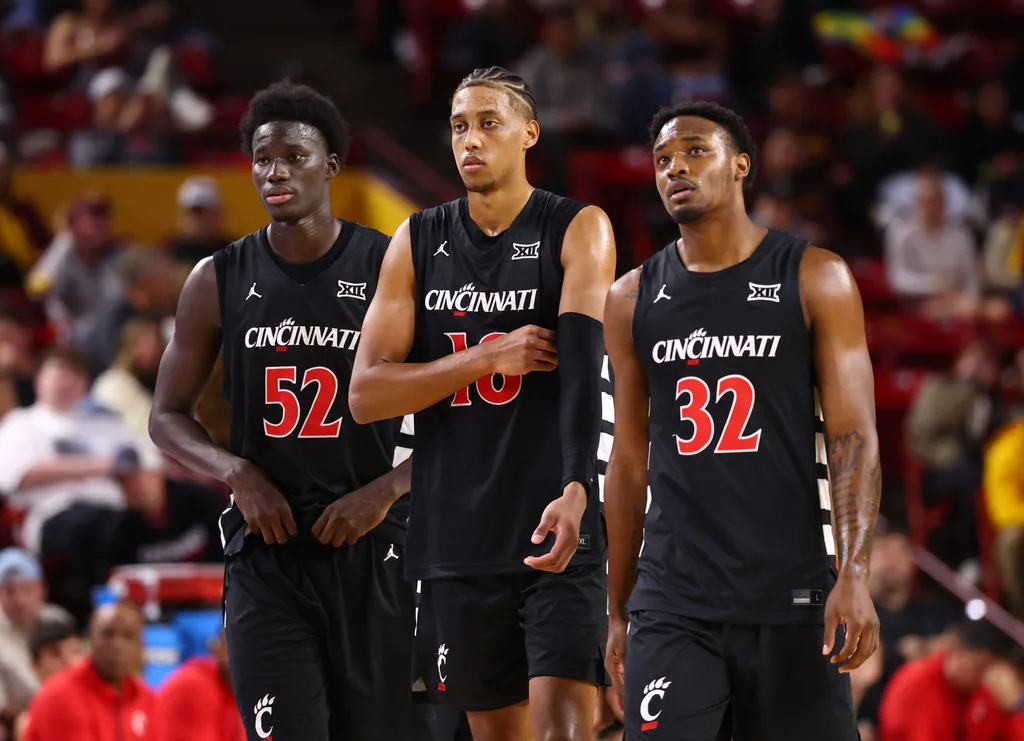 Jan 24, 2026; Tempe, Arizona, USA; Cincinnati Bearcats center Moustapha Thiam (52), forward Baba Miller (18) and guard Jalen Celestine (32) against the Arizona State Sun Devils at Desert Financial Arena. Mandatory Credit: Mark J. Rebilas-Imagn Images