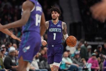 Jan 26, 2026; Charlotte, North Carolina, USA; Charlotte Hornets guard LaMelo Ball (1) brings the ball up court against the Philadelphia 76ers during the second half at Spectrum Center. Mandatory Credit: Jim Dedmon-Imagn Images