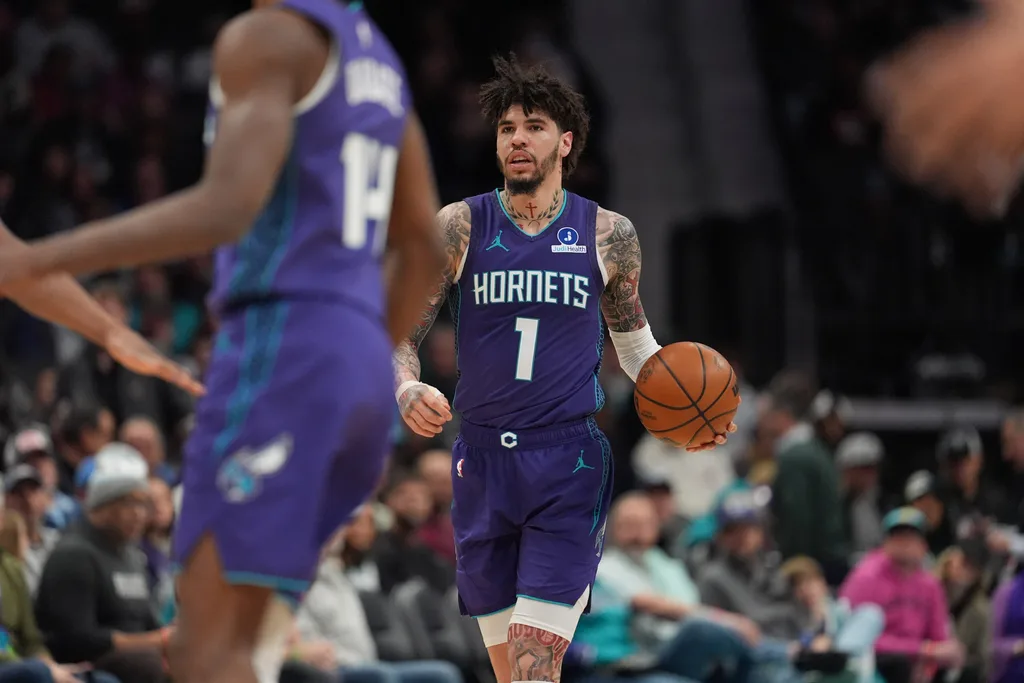Jan 26, 2026; Charlotte, North Carolina, USA; Charlotte Hornets guard LaMelo Ball (1) brings the ball up court against the Philadelphia 76ers during the second half at Spectrum Center. Mandatory Credit: Jim Dedmon-Imagn Images