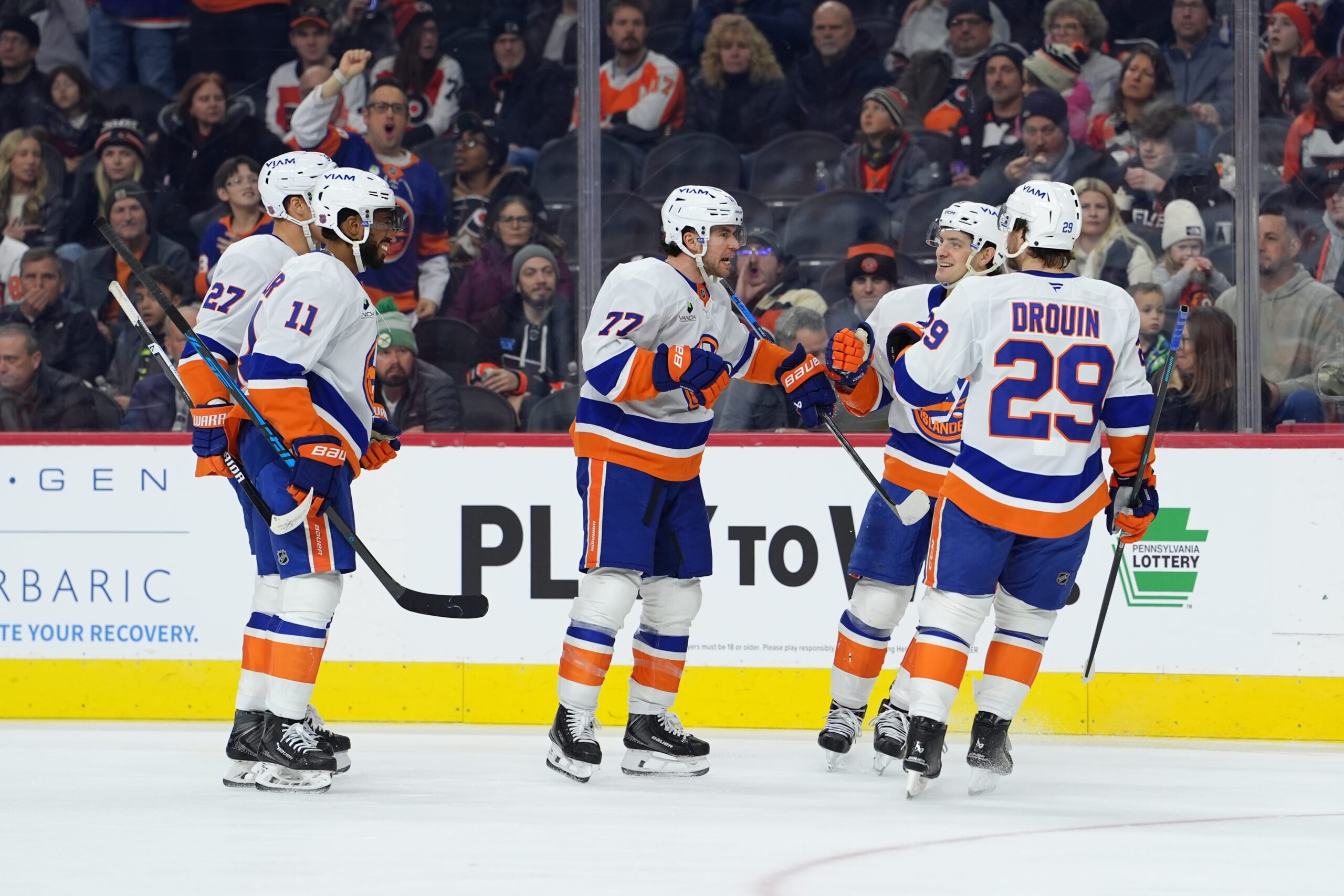Jan 26, 2026; Philadelphia, Pennsylvania, USA; New York Islanders defenseman Tony DeAngelo (77) reacts with teammates after scoring a goal against the Philadelphia Flyers in the second period at Xfinity Mobile Arena. Mandatory Credit: Kyle Ross-Imagn Images