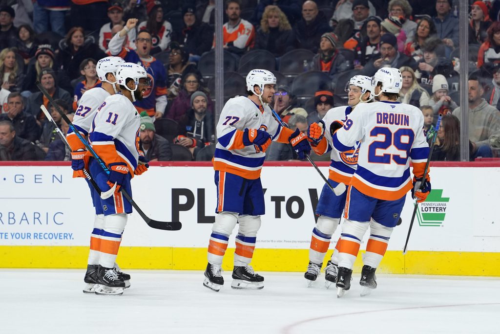 Jan 26, 2026; Philadelphia, Pennsylvania, USA; New York Islanders defenseman Tony DeAngelo (77) reacts with teammates after scoring a goal against the Philadelphia Flyers in the second period at Xfinity Mobile Arena. Mandatory Credit: Kyle Ross-Imagn Images