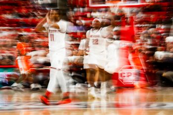 Jan 27, 2026; Raleigh, North Carolina, USA; NC State Wolfpack guard Quadir Copeland (11) and forward Ven-Allen Lubin (22) reacts to a win during the second half of the game against the Syracuse Orange at Lenovo Center. Mandatory Credit: Jaylynn Nash-Imagn Images