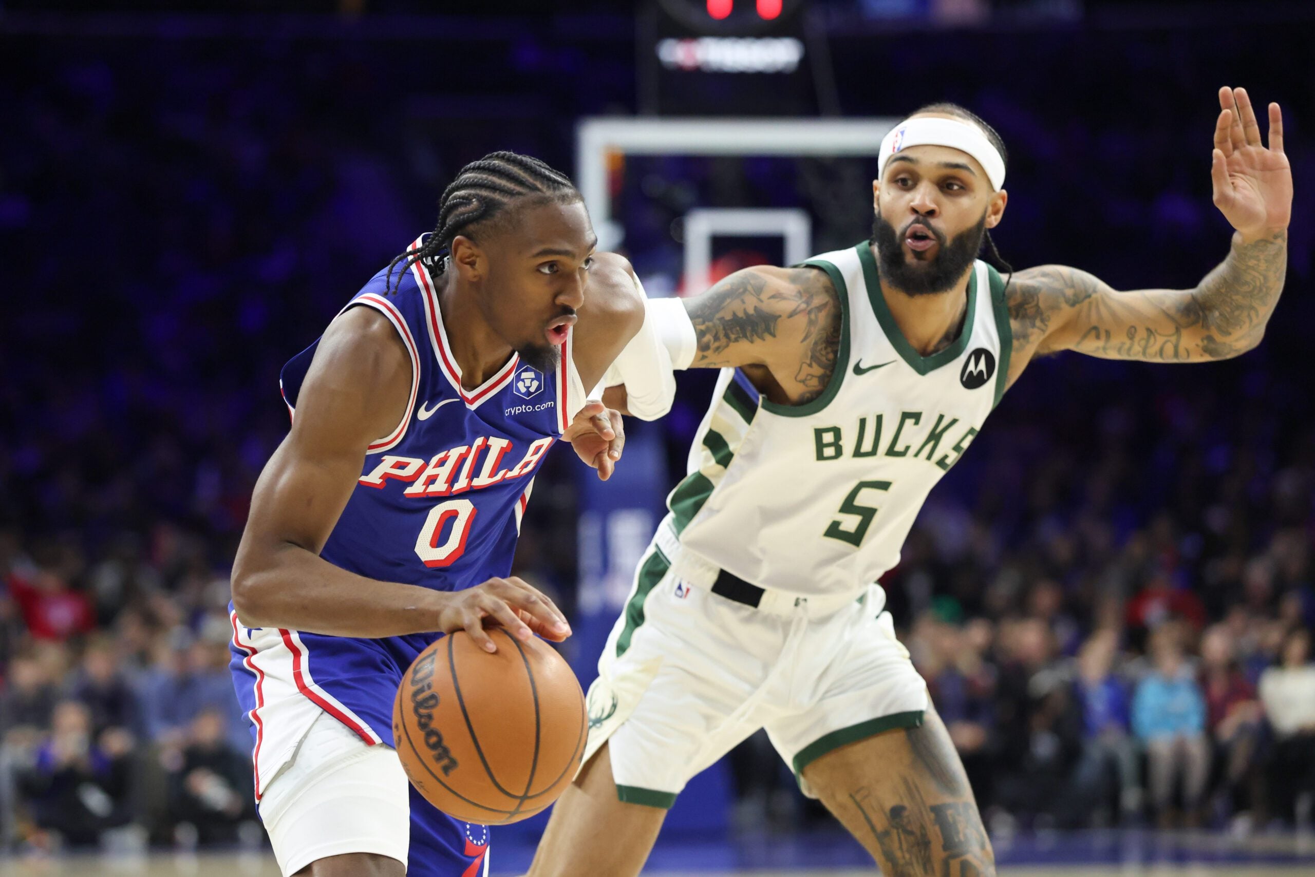 Jan 27, 2026; Philadelphia, Pennsylvania, USA; Philadelphia 76ers guard Tyrese Maxey (0) drives against Milwaukee Bucks guard Gary Trent Jr. (5) during the third quarter at Xfinity Mobile Arena. Mandatory Credit: Bill Streicher-Imagn Images
