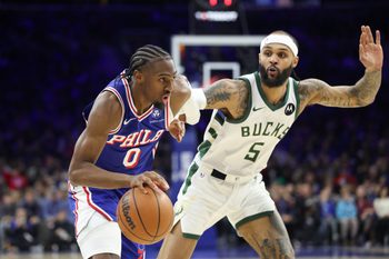 Jan 27, 2026; Philadelphia, Pennsylvania, USA; Philadelphia 76ers guard Tyrese Maxey (0) drives against Milwaukee Bucks guard Gary Trent Jr. (5) during the third quarter at Xfinity Mobile Arena. Mandatory Credit: Bill Streicher-Imagn Images
