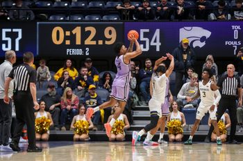 Jan 27, 2026; Morgantown, West Virginia, USA; Kansas State Wildcats guard PJ Haggerty (4) shoots a three pointer late in the second half against the West Virginia Mountaineers at Hope Coliseum. Mandatory Credit: Ben Queen-Imagn Imagesa
