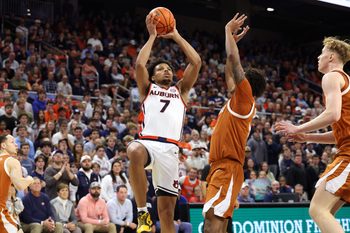 Jan 28, 2026; Auburn, Alabama, USA;  Auburn Tigers guard Keyshawn Hall (7) goes up for a shot against the Texas Longhorns during the second half at Neville Arena. Mandatory Credit: John Reed-Imagn Images