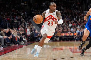 Jan 28, 2026; Toronto, Ontario, CAN; Toronto Raptors guard Jamal Shead (23) dribbles to the net against the New York Knicks during the second half at Scotiabank Arena. Mandatory Credit: John E. Sokolowski-Imagn Images