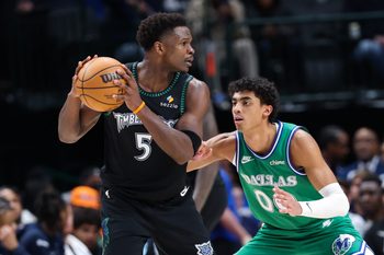 Jan 28, 2026; Dallas, Texas, USA;  Minnesota Timberwolves guard Anthony Edwards (5) looks to score as Dallas Mavericks guard Max Christie (00) defends during the second half at American Airlines Center. Mandatory Credit: Kevin Jairaj-Imagn Images