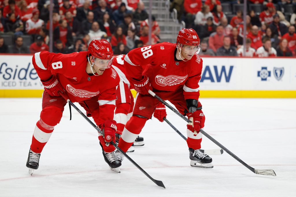 Jan 29, 2026; Detroit, Michigan, USA; Detroit Red Wings defenseman Ben Chiarot (8) and right wing Patrick Kane (88) gets set during a face off in the third period against the Washington Capitals at Little Caesars Arena. Mandatory Credit: Rick Osentoski-Imagn Images
