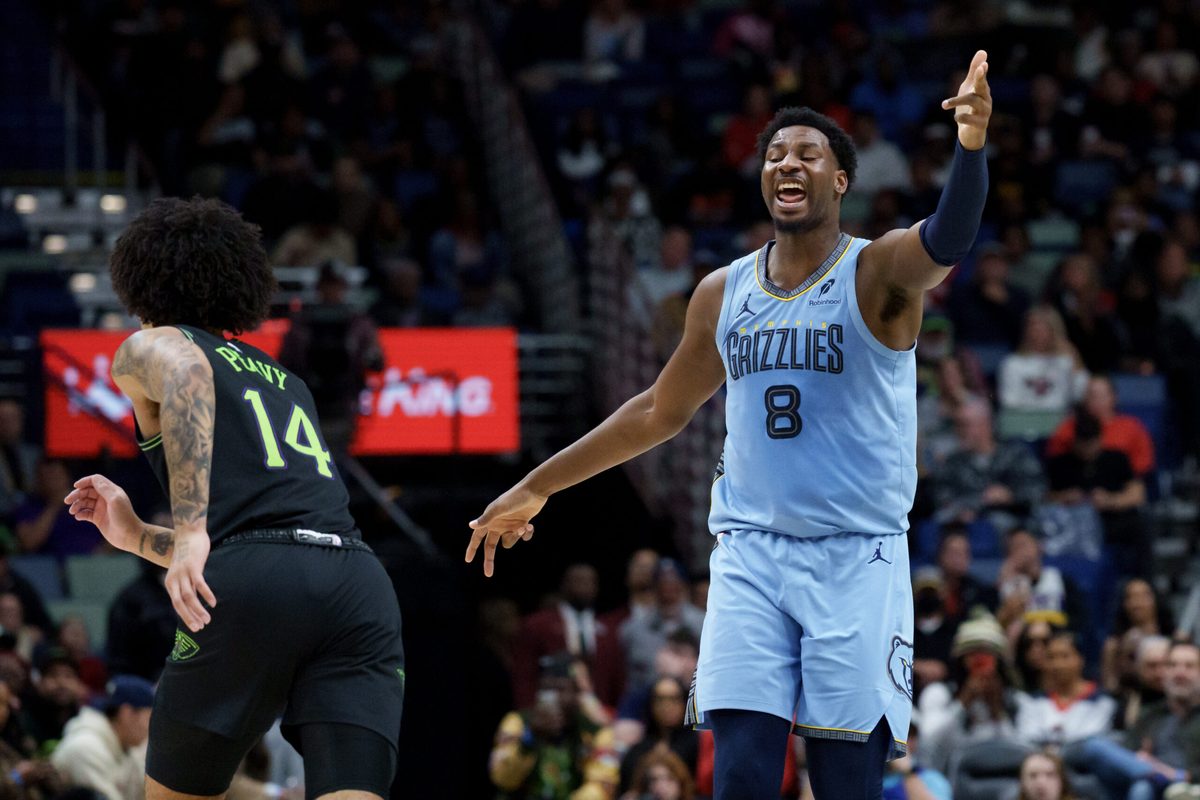 Jan 30, 2026; New Orleans, Louisiana, USA; Memphis Grizzlies forward Jaren Jackson Jr. (8) reacts after a three point basket against New Orleans Pelicans guard Micah Peavy (14) during the first half at Smoothie King Center. Mandatory Credit: Matthew Hinton-Imagn Images