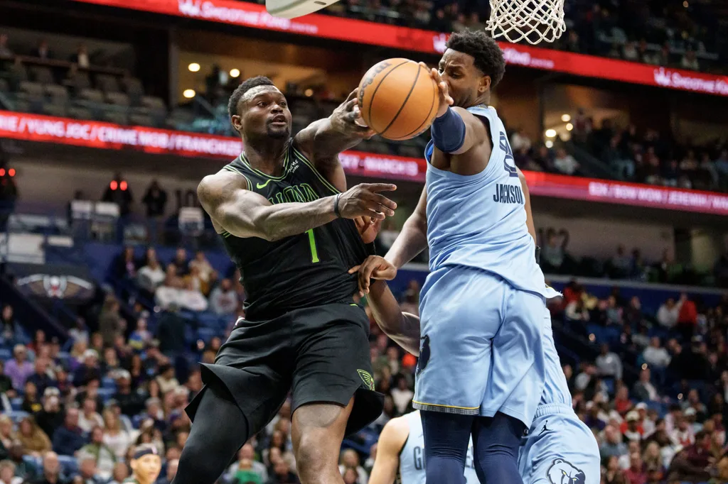Jan 30, 2026; New Orleans, Louisiana, USA; New Orleans Pelicans forward Zion Williamson (1) has his pass blocked by Memphis Grizzlies forward Jaren Jackson Jr. (8) during the second half at Smoothie King Center. Mandatory Credit: Matthew Hinton-Imagn Images