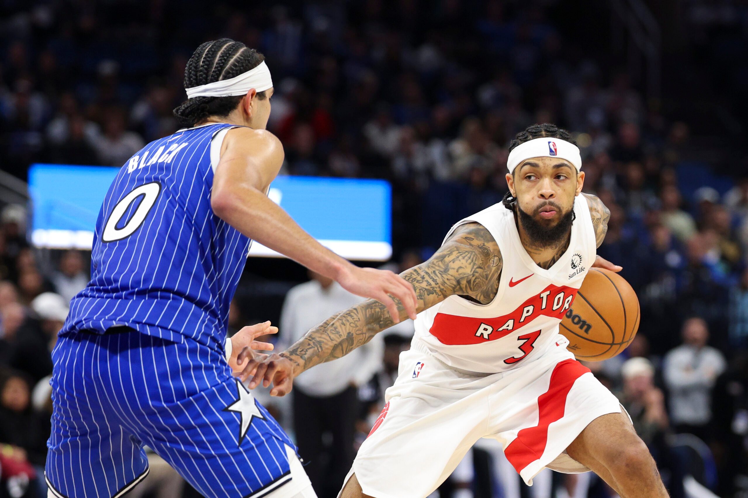 Jan 30, 2026; Orlando, Florida, USA; Toronto Raptors forward Brandon Ingram (3) is guarded by Orlando Magic guard Anthony Black (0) in the fourth quarter at Kia Center. Mandatory Credit: Nathan Ray Seebeck-Imagn Images