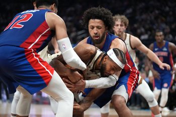 Jan 30, 2026; San Francisco, California, USA; Golden State Warriors guard Moses Moody (4) and Detroit Pistons guard Cade Cunningham (2) battle for control of the ball in the fourth quarter at the Chase Center. Mandatory Credit: Cary Edmondson-Imagn Images