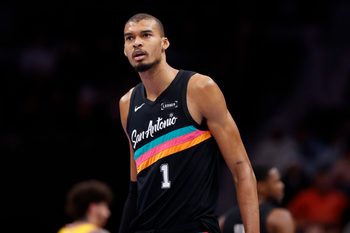 Jan 31, 2026; Charlotte, North Carolina, USA; San Antonio Spurs forward Victor Wembanyama (1) walks down the court during second half action against the Charlotte Hornets at Spectrum Center. Mandatory Credit: Brian Westerholt-Imagn Images