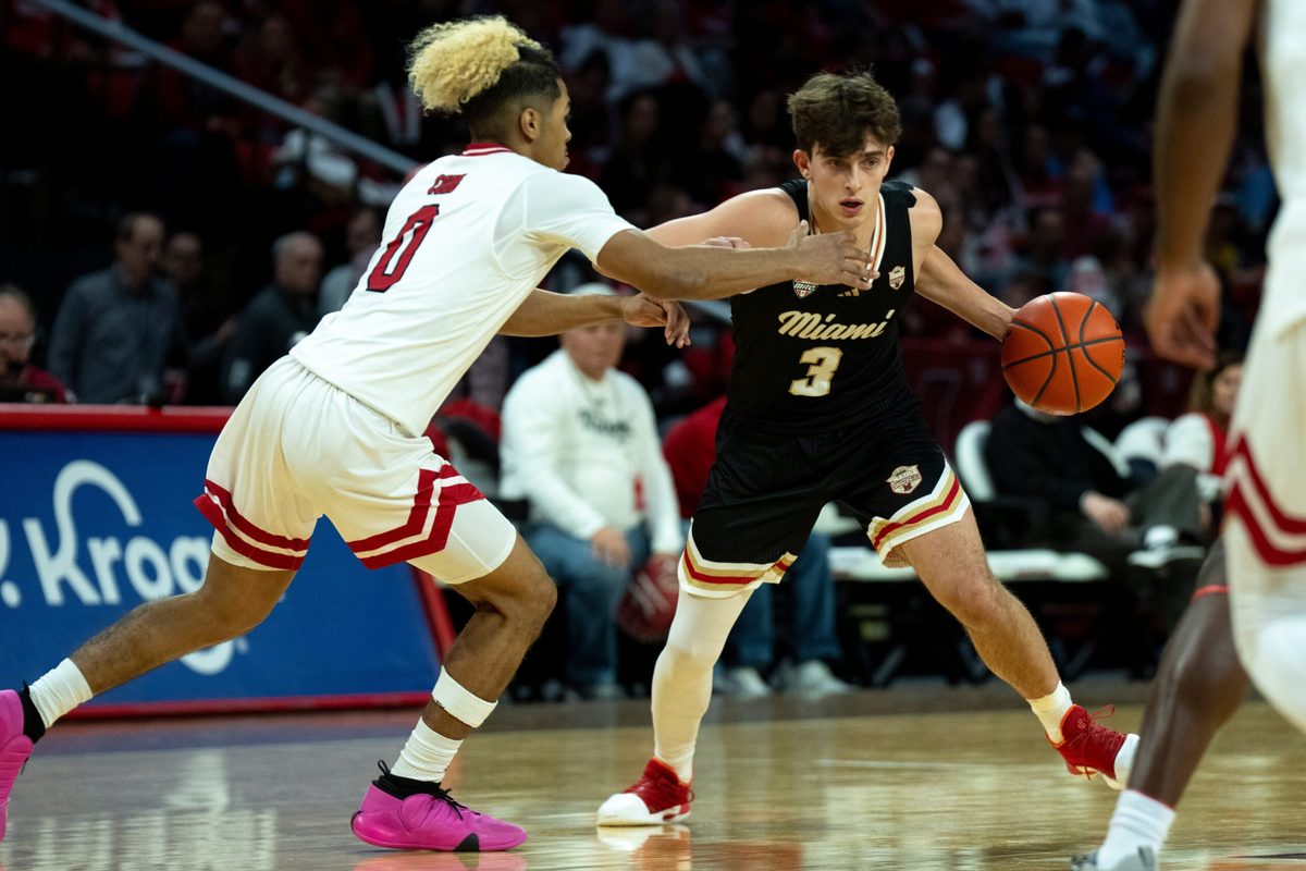 Miami RedHawks guard Luke Skaljac (3) drives on Northern Illinois Huskies guard Gianni Cobb (0) in the first half of the NCAA Basketball game at Millett Hall in Oxford, Ohio, on Saturday, January 31, 2026.