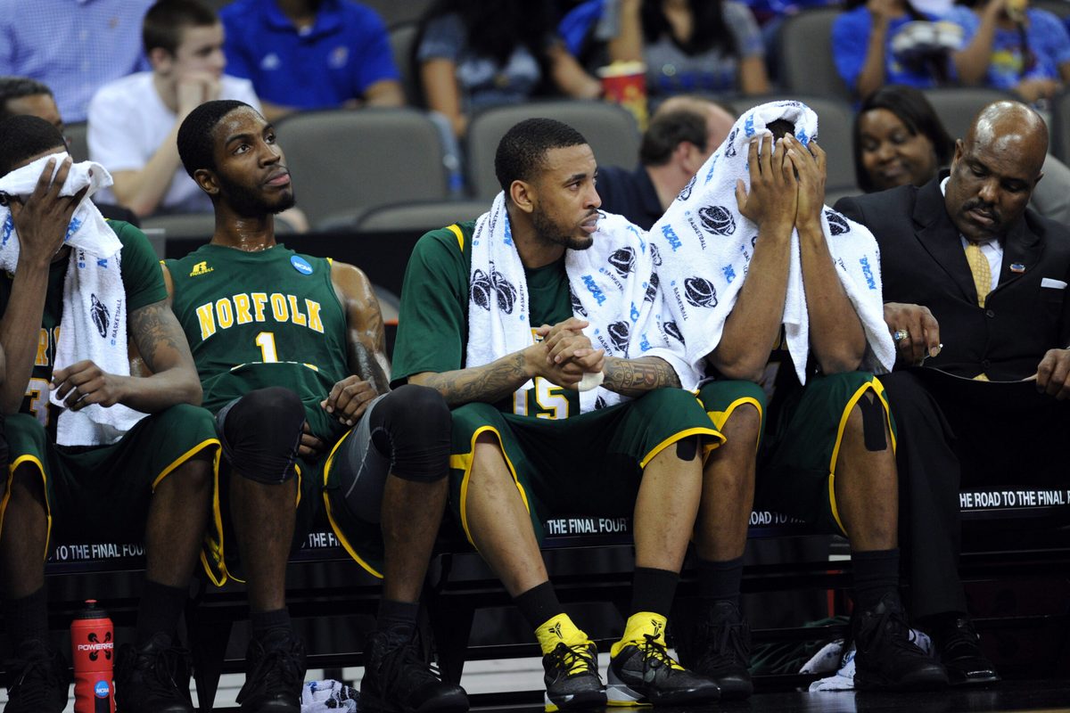 Mar 18, 2012; Omaha, NE, USA; Norfolk State Spartans players Brandon Wheeless (right) Rodney McCauley (center) and Rob Johnson (left) reacts after losing to the Florida Gators in the third round of the 2012 NCAA men's basketball tournament at the CenturyLink Center.  Florida defeated Norfolk State 84-50.  Mandatory Credit: Peter G. Aiken-Imagn Images