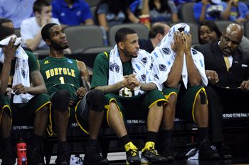 Mar 18, 2012; Omaha, NE, USA; Norfolk State Spartans players Brandon Wheeless (right) Rodney McCauley (center) and Rob Johnson (left) reacts after losing to the Florida Gators in the third round of the 2012 NCAA men's basketball tournament at the CenturyLink Center.  Florida defeated Norfolk State 84-50.  Mandatory Credit: Peter G. Aiken-Imagn Images
