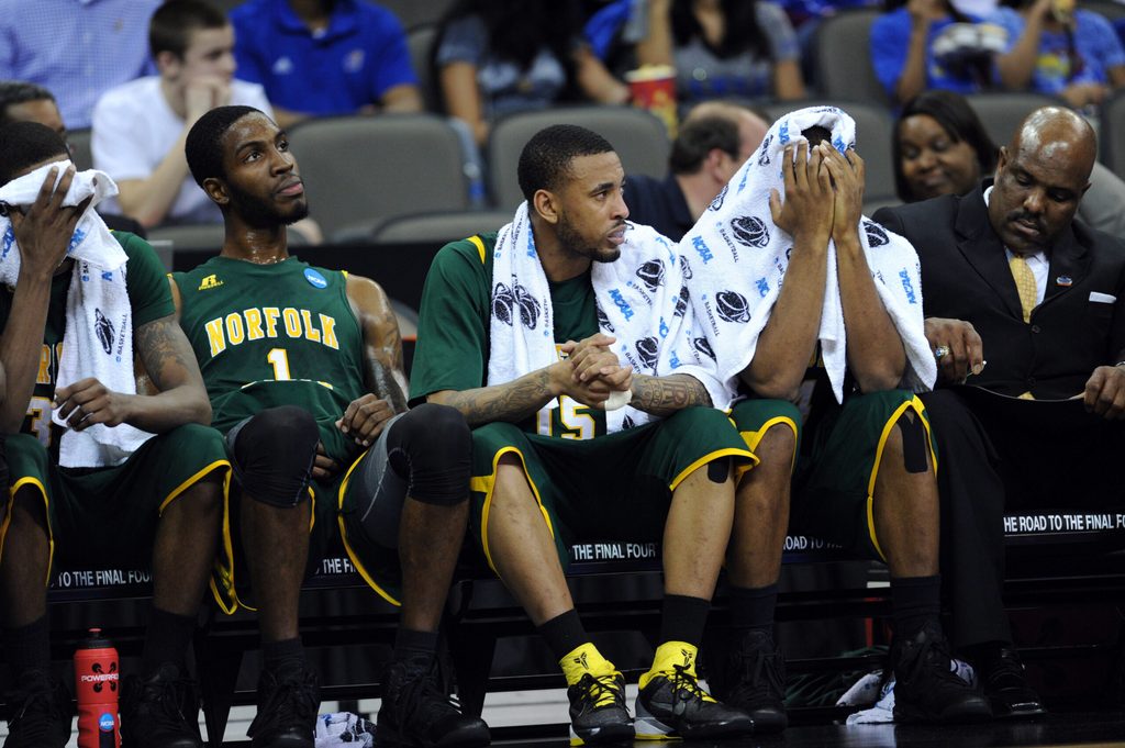 Mar 18, 2012; Omaha, NE, USA; Norfolk State Spartans players Brandon Wheeless (right) Rodney McCauley (center) and Rob Johnson (left) reacts after losing to the Florida Gators in the third round of the 2012 NCAA men's basketball tournament at the CenturyLink Center. Florida defeated Norfolk State 84-50. Mandatory Credit: Peter G. Aiken-Imagn Images