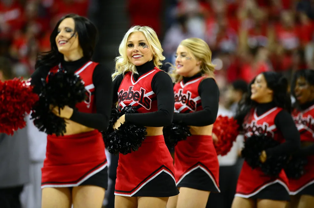 Mar 16, 2013; Las Vegas, NV, USA; UNLV Rebels cheerleaders perform during the game against the New Mexico Lobos during the championship game of the Mountain West tournament at the Thomas & Mack Center. Mandatory Credit: Ron Chenoy-Imagn Images