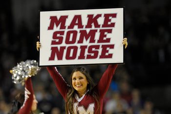 Jan 11, 2014; Amherst, MA, USA; The Massachusetts Minutemen cheerleaders perform during a timeout in the second half against the St. Bonaventure Bonnies at Mullins Center. Mandatory Credit: Bob DeChiara-Imagn Images