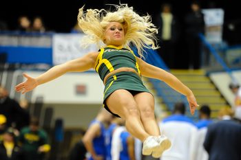 Mar 11, 2014; Sioux Falls, SD, USA; A North Dakota State Bisons cheerleader performs during a break against the Fort Wayne Mastodons in the championship game of the Summit Conference tournament at Sioux Falls Sports. North Dakota State defeated Fort Wayne 60-57. Mandatory Credit: Steven Branscombe-Imagn Images