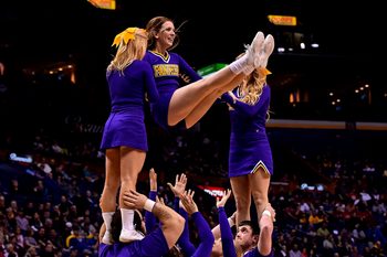 Mar 8, 2015; St. Louis, MO, USA; Northern Iowa Panthers cheerleaders perform during a time out in the game between the Illinois State Redbirds and the Northern Iowa Panthers during the championship game of the Missouri Valley Conference basketball tournament at Scotttrade Center. Mandatory Credit: Jasen Vinlove-Imagn Images