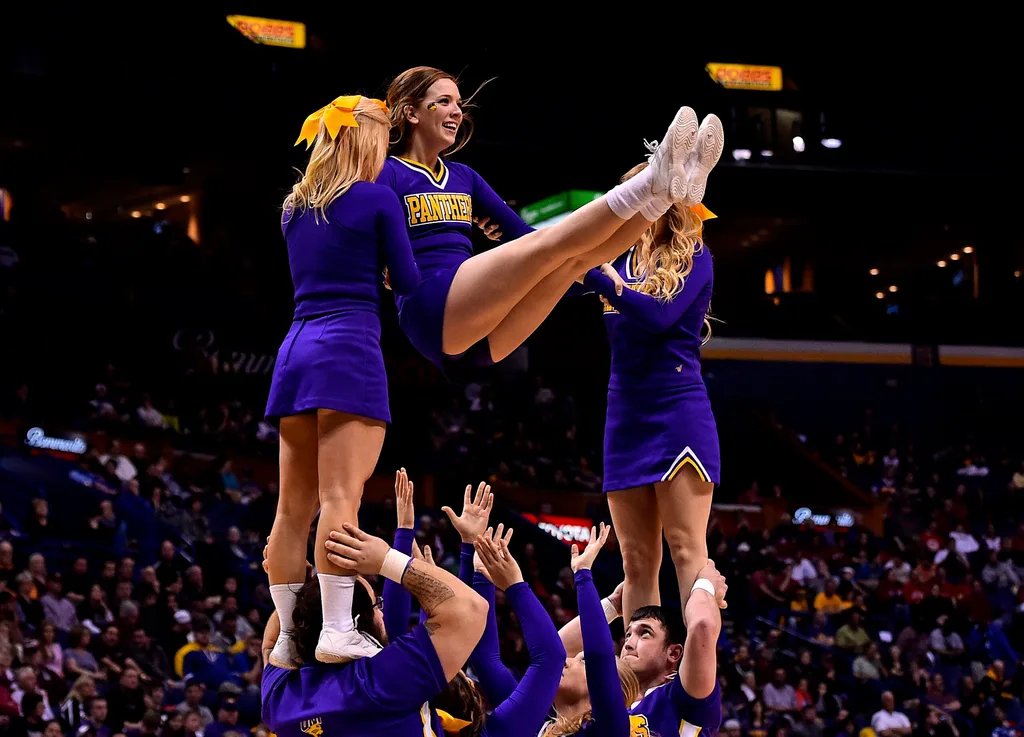 Mar 8, 2015; St. Louis, MO, USA; Northern Iowa Panthers cheerleaders perform during a time out in the game between the Illinois State Redbirds and the Northern Iowa Panthers during the championship game of the Missouri Valley Conference basketball tournament at Scotttrade Center. Mandatory Credit: Jasen Vinlove-Imagn Images